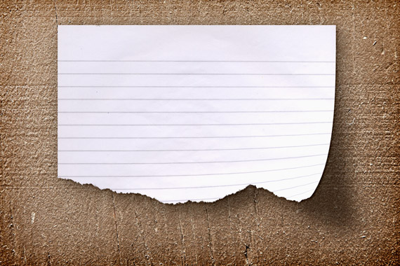 Realistic Torn Paper Note On A Wood Background