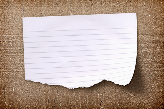 Realistic Torn Paper Note On A Wood Background